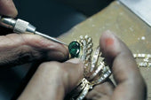 Engraver working on jewelry engraving