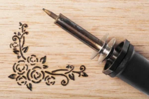 Pneumatic Engraving Machine Engraving a Wooden Board